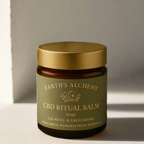 Sacred Ritual Balm in amber jar, minimal label on neutral background