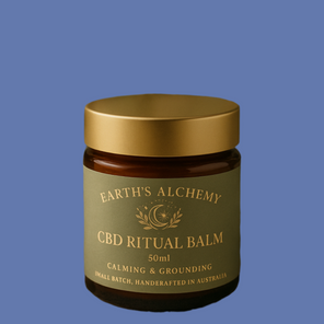 CBD Ritual Balm jar with gold lid on a blue background