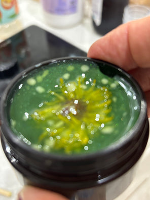 Rich creamy balm texture in jar, softly lit for ritual beauty