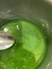 Hand scooping Sacred Ritual Balm as part of a mindful nightly ritual