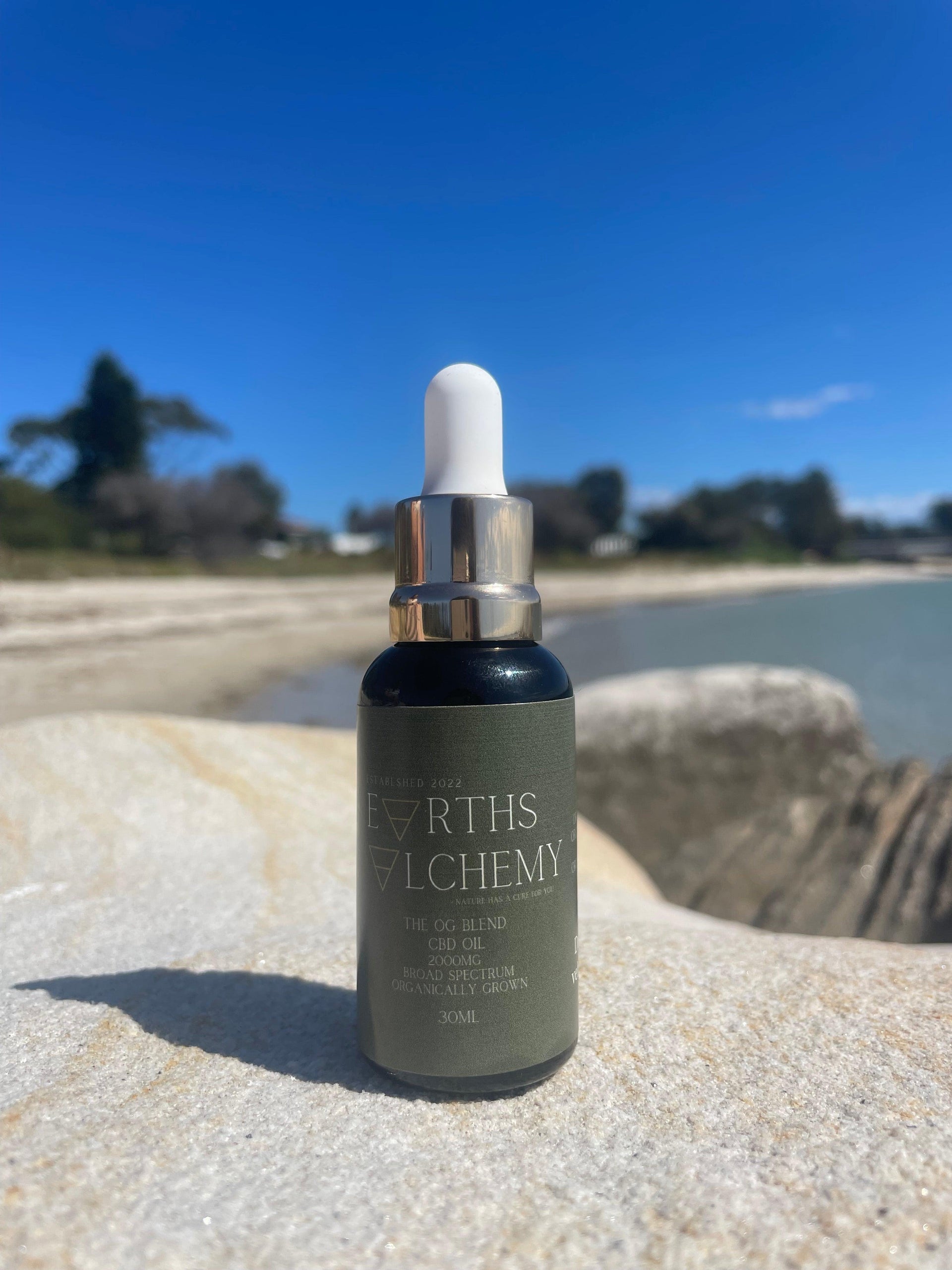 Earth’s Alchemy botanical extract oil styled with calming botanicals for ritual